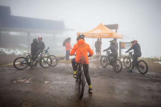 Mt Buller, Australia - January 16 2021: Practice round for the Victorian Downhill Mountain Bike Series after a summer snow storm