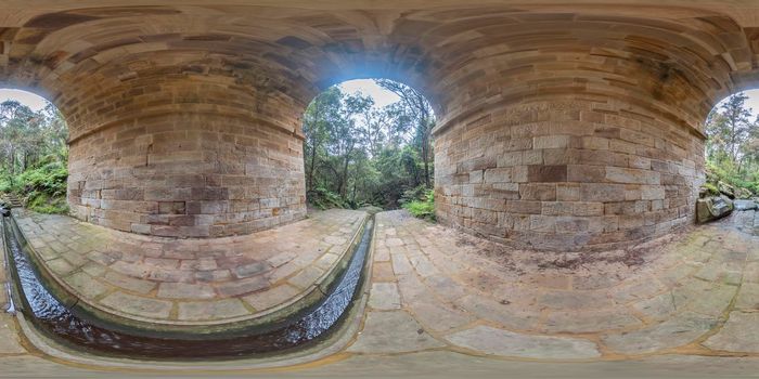 Spherical 360 panoramic photograph of Lapstone Creek and the World Heritage listed Lennox Bridge in Glenbrook in The Blue Mountains in regional New South Wales in Australia