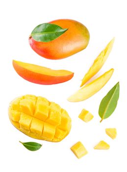 mango slice with green leaves isolated on white background.