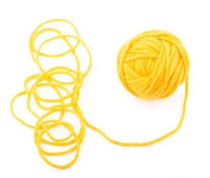 The idea is a tangled thread. Yellow ball of yarn on white background