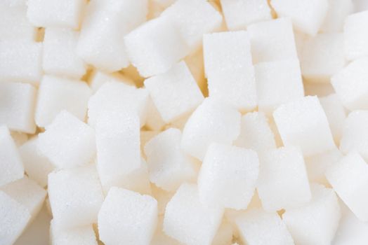 Sugar cube texture background sweet food ingredient, studio shot health high blood risk of diabetes, and calorie intake concept