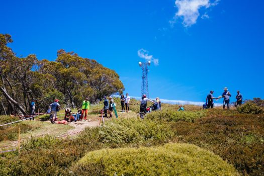MT BULLER, AUSTRALIA - JANUARY 16, 2021: Liam Eaton is attended to after a crash during the finals for the Victorian Downhill Mountain Bike Series at Mt Buller