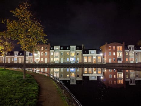 Housing along the canal at night in Sneek, Friesland, The Netherlands