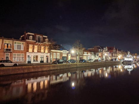 Housing along the canal at night in Sneek, Friesland, The Netherlands