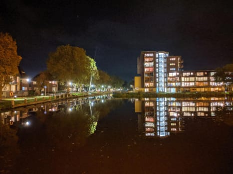 Housing along the canal at night in Sneek, Friesland, The Netherlands