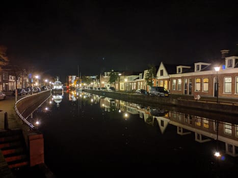 Housing along the canal at night in Sneek, Friesland, The Netherlands