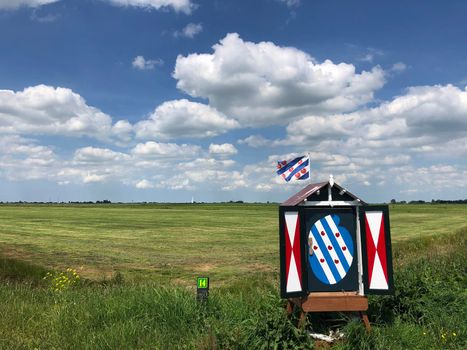 Frisian box and flag around It Heidenskip in Friesland, The Netherlands