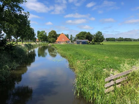 Canal towards the village Easterwierrum in Friesland The Netherlands