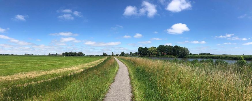 Bicycle path through Friesland in The Netherlands