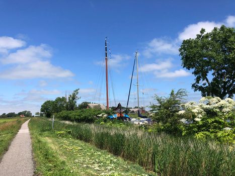 Bicycle path through Friesland in The Netherlands