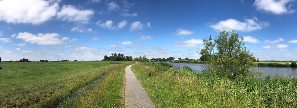 Bicycle path next to the Dokkumer Ee canal in Friesland, The Netherlands
