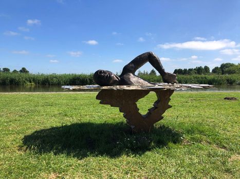 Statue from long distance and marathon swimmer Maarten van der Weijden in Burdaard, Friesland, The Netherlands