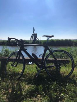 Race bicycle with a windmill in The Netherlands