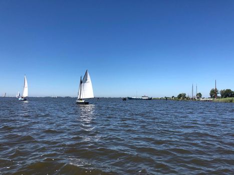 Sailing on a lake in Friesland The Netherlands