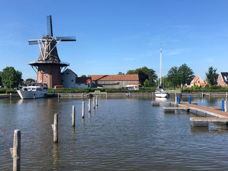 Windmill and dock in Burdaard, Friesland, The Netherlands