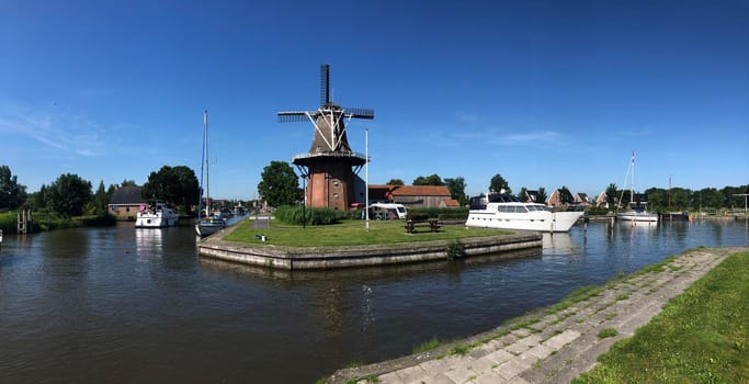 Windmill and dock in Burdaard, Friesland, The Netherlands