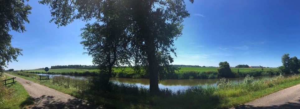 Panoramic landscape from around Engwierum, Friesland, The Netherlands