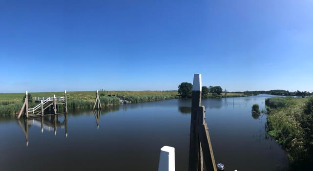 Panorama from the canal around the sea lock in Dokkumer Nije Silen, Friesland The Netherlands