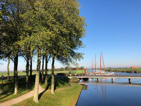 Tractor crossing a bridge in Sloten, Friesland The Netherlands