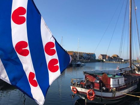 Frisian flag in the harbor of Stavoren, Friesland The Netherlands 
