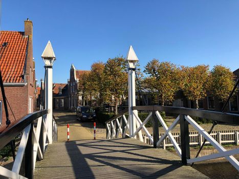 Bridge over a canal during autumn in Hindeloopen, Friesland The Netherlands