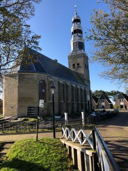 Church in Dyke Hindeloopen during autumn in Friesland, The Netherlands