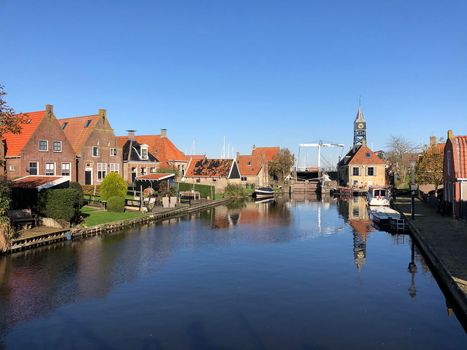 Canal in Hindeloopen during autumn in Friesland, The Netherlands