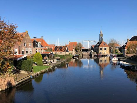 Canal in Hindeloopen during autumn in Friesland, The Netherlands