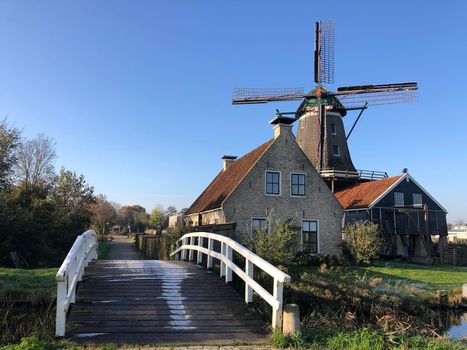 Windmill in IJlst during autumn in Friesland, The Netherlands