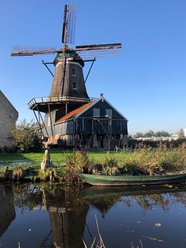 The windmill in IJlst during autumn in Friesland, The Netherlands