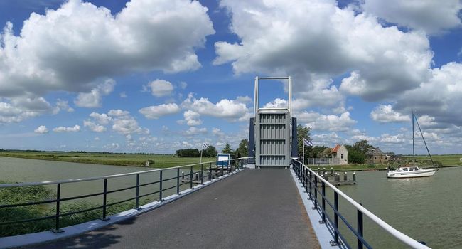 Bridge open for a sailboat in Friesland The Netherlands