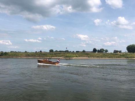 Boat on the river IJssel around Dieren, The Netherlands