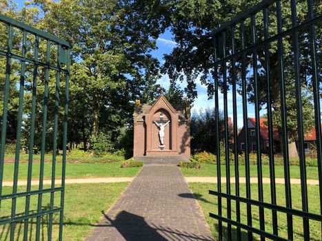 Cross with jesus statue in Zieuwent, The Netherlands