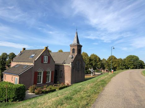 Small church behind the dyke around Millingen aan de Rijn in The Netherlands