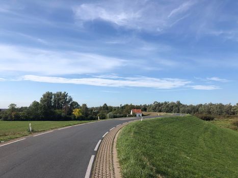 Road on a dyke around Kekerdom in Gelderland The Netherlands