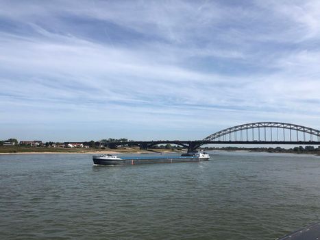 Cargo ship on the Waal river in Nijmegen, The Netherlands