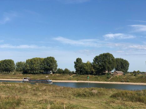 Cargo ship on the Pannerdensch canal around Pannerden in Gelderland The Netherlands