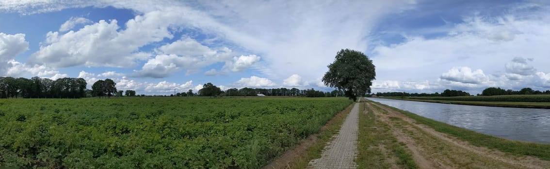 Panorama from a bicycle path next to a canal around Hardenberg, The Netherlands