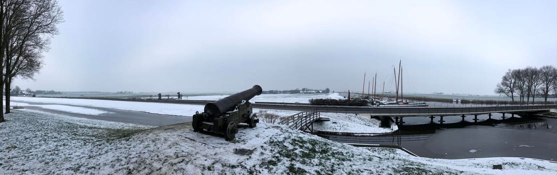 Panorama winter landscape in Sloten, Friesland, The Netherlands