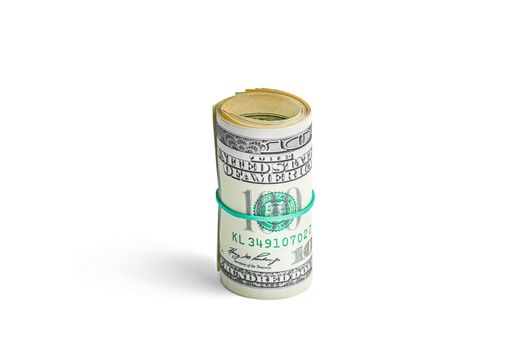 Money on a roll tied with an elastic band. The isolated object on a white background with a shadow. Close up photo of money. U.S. dollars. Banknotes. Paper money isolated on white background.