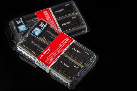 Moscow, Russia - 25 Dec 2020: DDR4 RAM modules in their original packaging on a black table