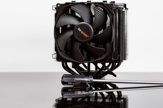 Moscow, Russia - 25 Dec 2020: Brand new clean black CPU air cooler with huge radiators. PC cooling, high end cooling oc system