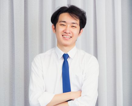 Portrait of happy business handsome man confident wearing shirt pose standing smiling looking to camera he crossed arm