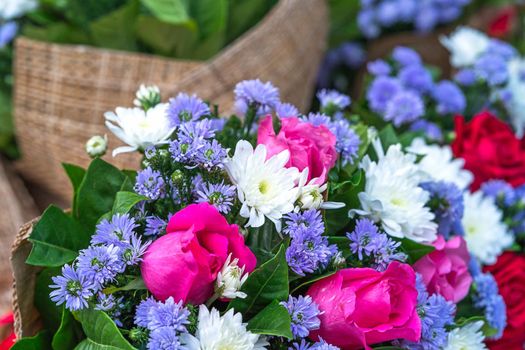 Beautiful bouquet made of roses and other flowers in various colors