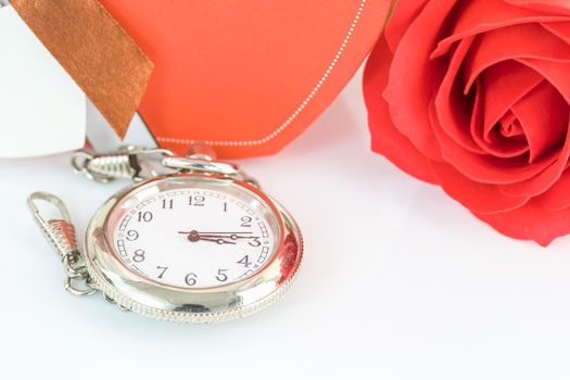 Close up pocket watch and red roses flower with copy space, Valentine'sDay concept