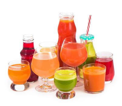Glasses with fresh organic vegetable and fruit juices isolated on white. Detox diet