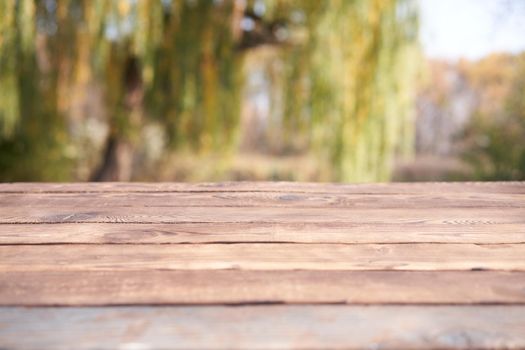 Empty wooden table nature bokeh background with a country outdoor theme,Template mock up for display of product Copy space