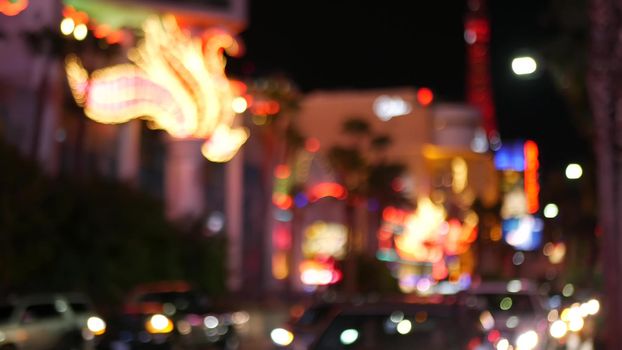 Defocused fabulous Las Vegas Strip boulevard, luxury casino and hotel, gambling area in Nevada, USA. Nightlife and traffic near Fremont street in tourist money playing resort. Neon lights of sin city.