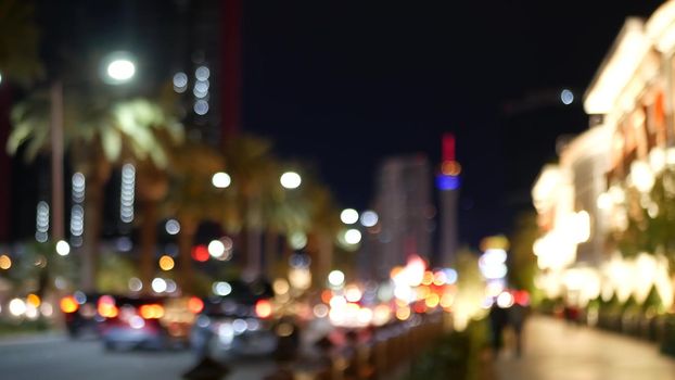 Defocused fabulous Las Vegas Strip boulevard, luxury casino and hotel, gambling area in Nevada, USA. Nightlife and traffic near Fremont street in tourist money playing resort. Neon lights of sin city.