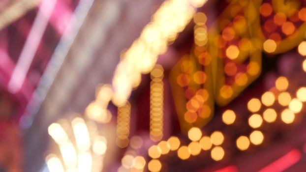 Defocused old fasioned electric lamps glowing at night. Abstract close up of blurred retro casino decoration shimmering, Las Vegas USA. Illuminated vintage style bulbs glittering on Freemont street.